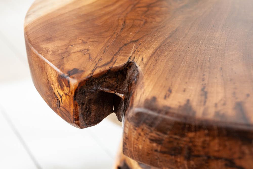 Invicta INTERIOR at riess-ambiente.de offers the tree trunk stool ROOT. Made of solid teak root wood, this versatile piece serves as a stool, side table or footrest in natural style.