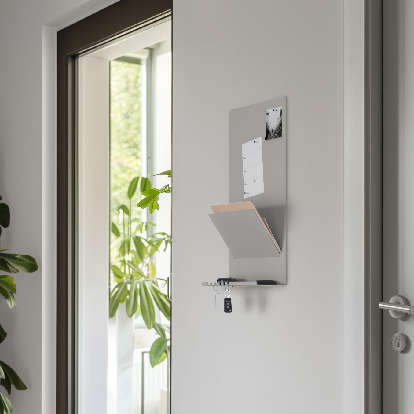 Offering wall organizer shelf made of steel structure. 30 x 9 x 49 cm 3-in-1 wall shelf with magnetic board and magnets. Board for keys, newspapers, and notes. Gray color.