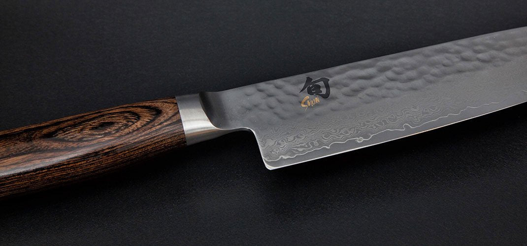 KAI Shun Premier Tim Mälzer Japanese utility knife 10 cm blade length - VG-MAX core 61 (±1) HRC, 32 layers of polished damascus steel - medium brown pakkawood handle - hammer finish surface - Made in Japan