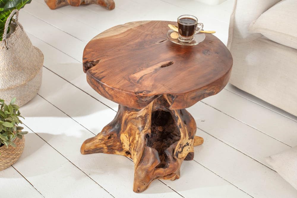 Invicta INTERIOR at riess-ambiente.de offers the tree trunk stool ROOT. Made of solid teak root wood, this versatile piece serves as a stool, side table or footrest in natural style.