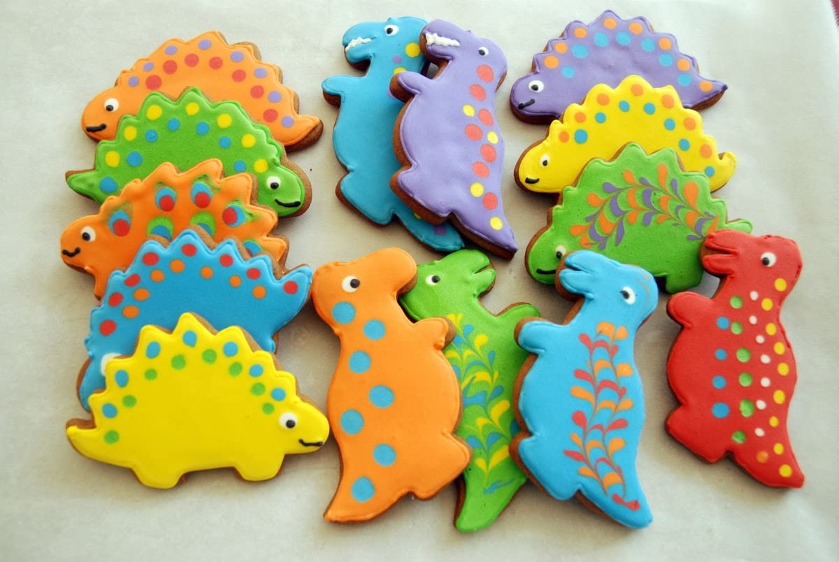 47-piece children's kitchen knife set with dinosaur cookie cutters and kid-friendly knives for cutting cakes, cookies, fruit, sandwiches, and vegetables.