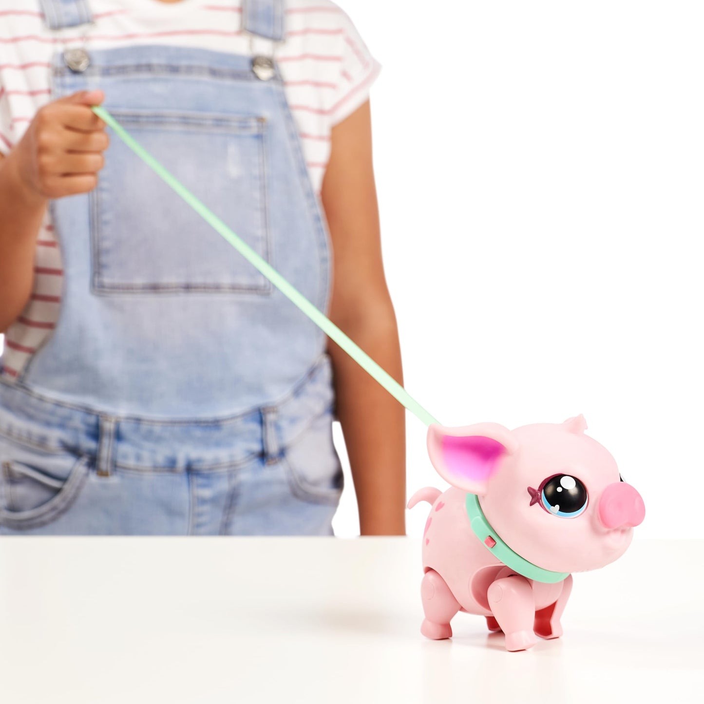 Little Live Pets - My Pet Pig, a cuddly interactive toy pig that walks, dances, and nuzzles. Featuring 20+ sounds and reactions. Batteries included. Ideal for kids ages 4 and up. Pink color.