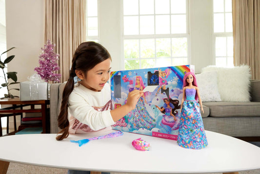 Barbie Advent calendar with doll and 24 surprise accessories including unicorn and 3 animals. The fashion doll with pink hair can transform into a mermaid, fairy, and more.