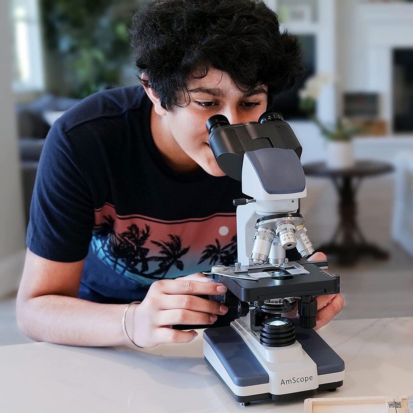Amscope 40x-2500X digital binocular compound microscope with multiple objectives, x/y mechanical stage, Abbe condenser with iris diaphragm.