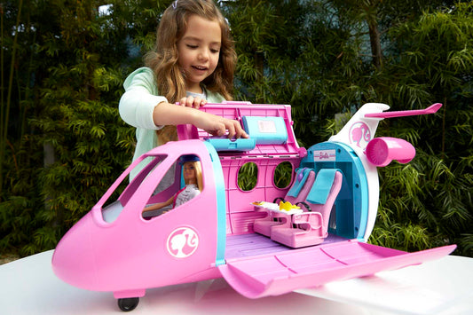 Barbie airplane with pilot doll, featuring movable wheels and 15 accessories including pet and trolley, in pink, suitable for ages 3 and up, GJB33.