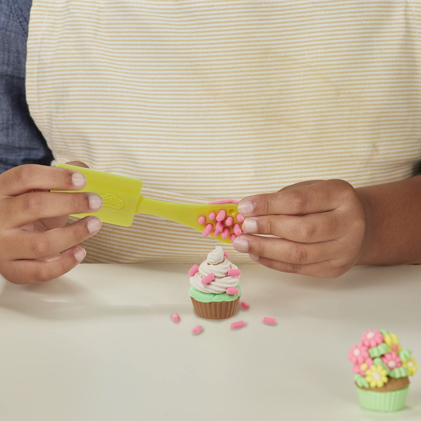 Play-Doh Kitchen Creations Kitchen Machine and Cookie Party Playset for kids aged 3 and up, comes with 15 cans.