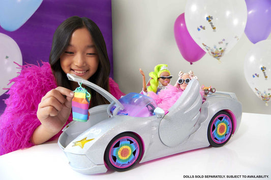 Barbie Extra Convertible Car in silver with moving wheels, includes accessories like clothing and pet, suitable for ages 3 and up. HDJ47.