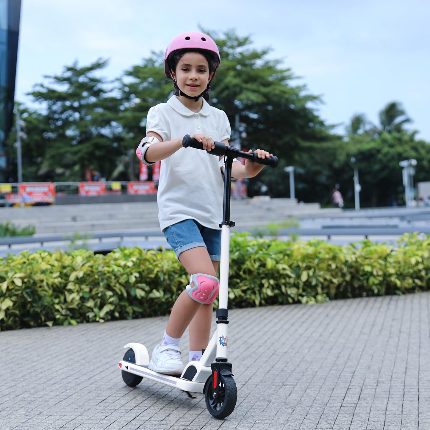 Caroma electric scooter for kids aged 8-12, 150W motor, 16 km/h, 60 min ride time, Adjustable speed & height, Colorful lights, LED display, Foldable kids electric scooter.