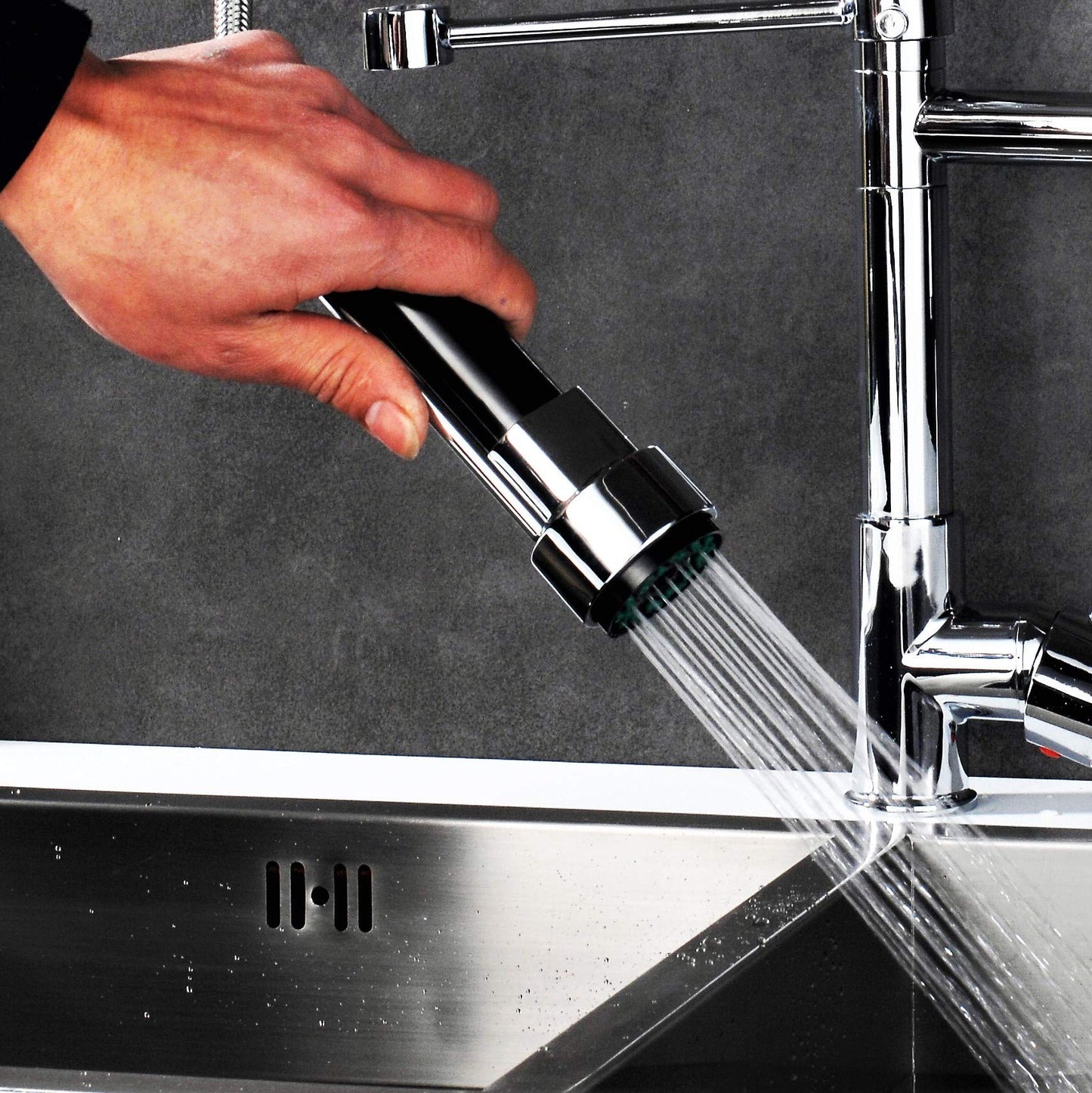 Professional kitchen sink mixer tap with shower spray, spiral spring, and extendable hose in gloss/chrome finish.
