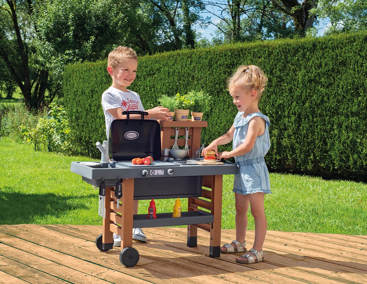Smoby - Outdoor garden play kitchen - includes grill, sink with water pump function, and many accessories, for children ages 3 and up.