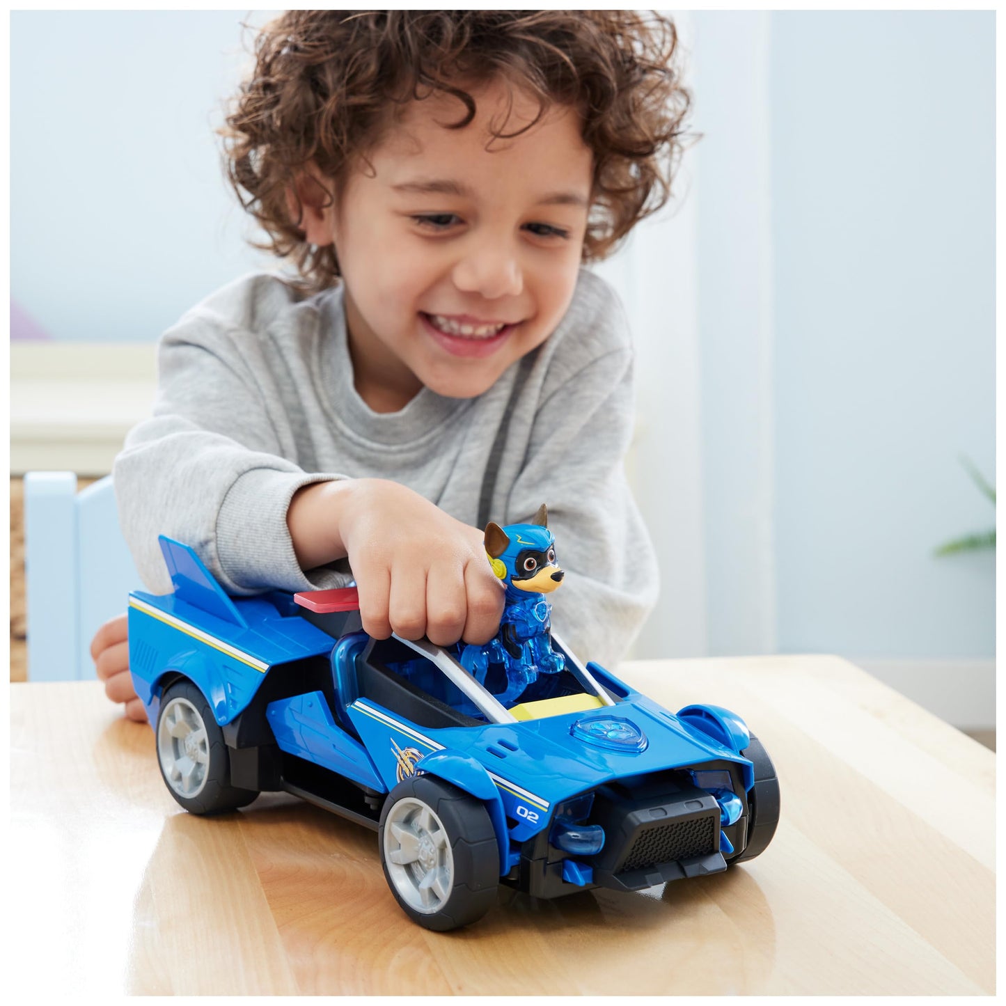 PAW PATROL: The Mighty Pups Movie, 40cm long Chase Deluxe Superhero Rocket Vehicle incl. Chase figure, lights and sounds, suitable for children aged 3 and up.