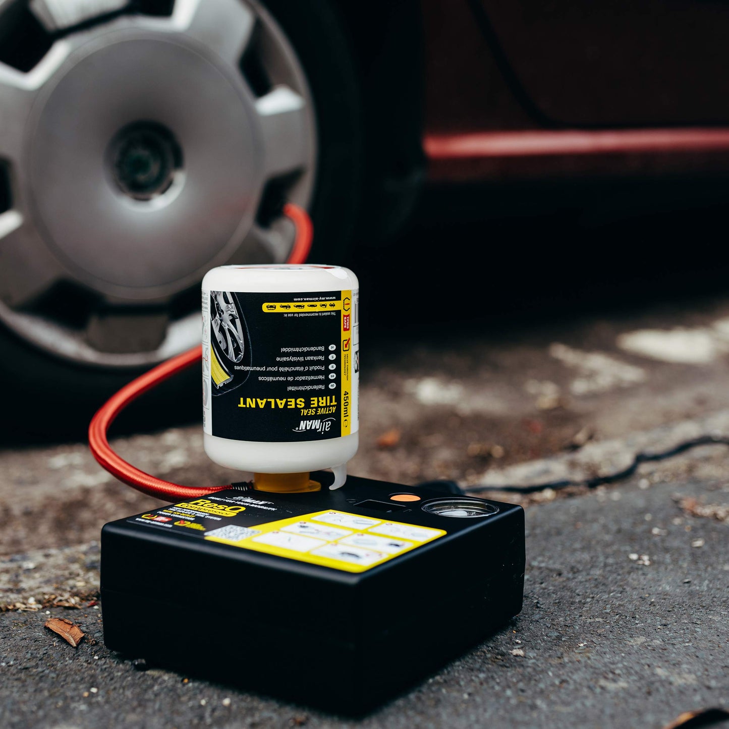 AirMan Resq tire repair kit for cars, featuring Valve-Through technology, repairs all tire types, including the powerful 12V air compressor tire sealant.