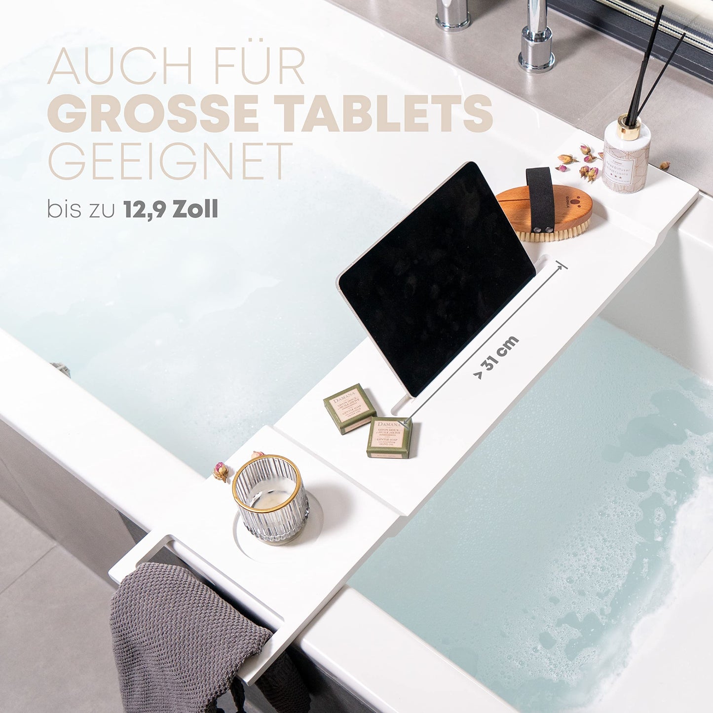 Pampeliška Premium bathtub tray in white with bamboo towel holder. Includes e-book/smartphone/tablet holder, wine glass holder, and candle holder. A luxurious addition to your bath time.