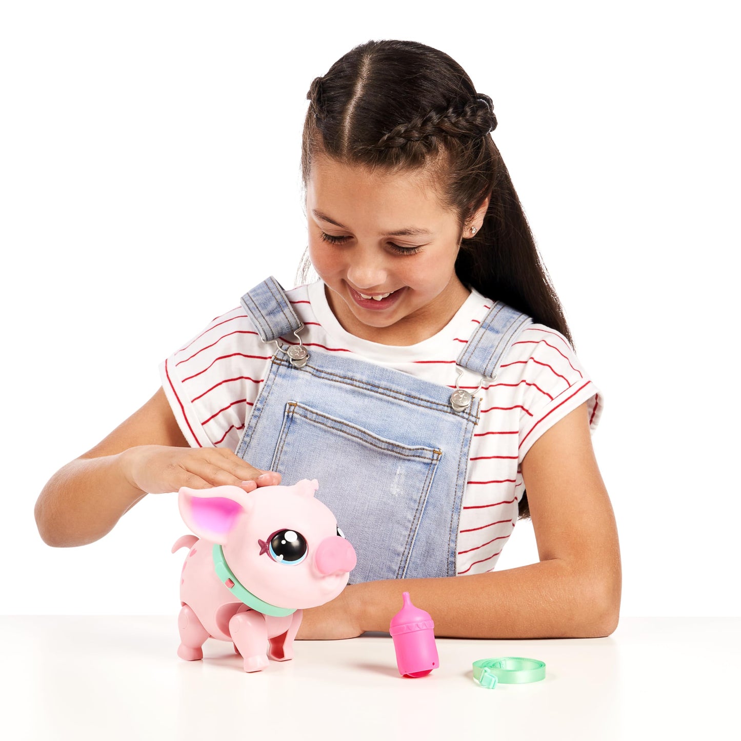 Little Live Pets - My Pet Pig, a cuddly interactive toy pig that walks, dances, and nuzzles. Featuring 20+ sounds and reactions. Batteries included. Ideal for kids ages 4 and up. Pink color.