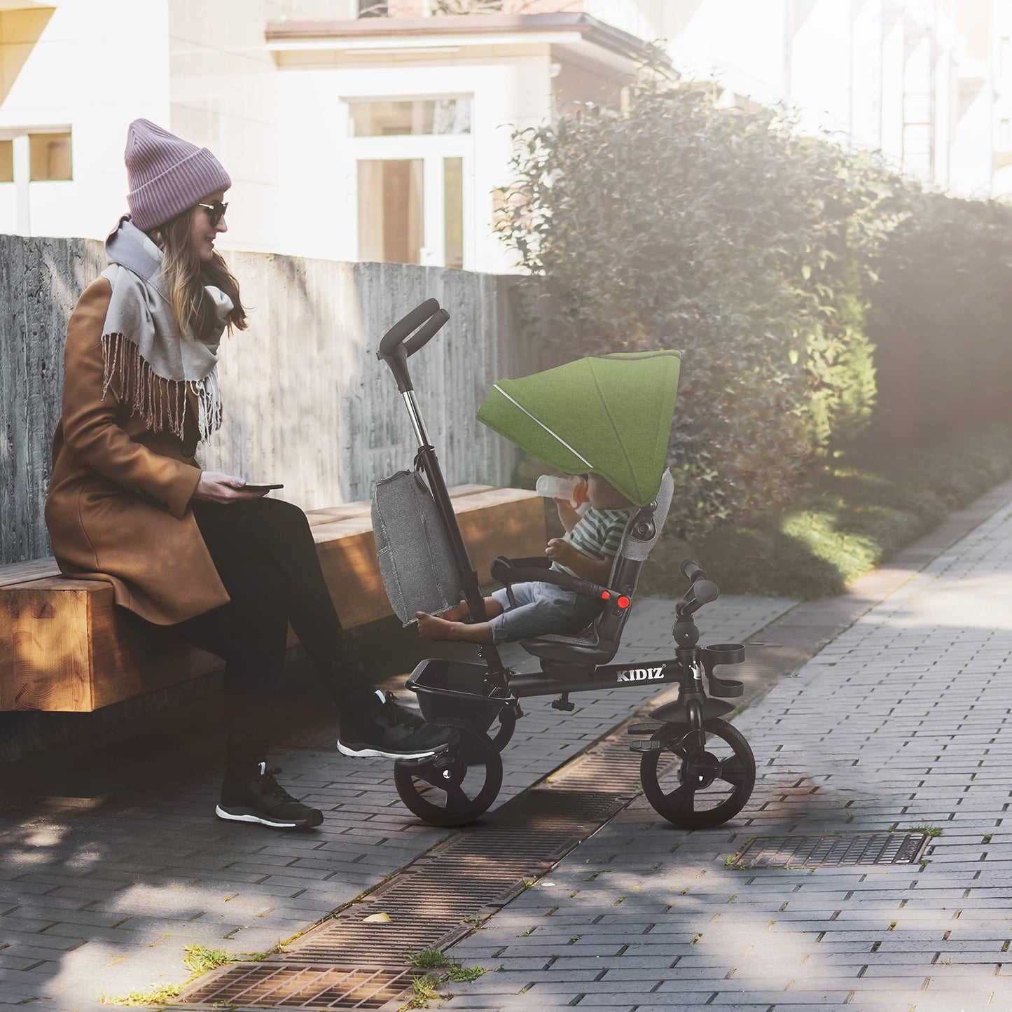 KIDIZ® 6in1 tricycle for kids with handlebar, suitable from 9 months up to 25kg. Jogger with forward & reverse drive, basket, bag, cup holder, sun canopy, rubber wheels. Foldable in khaki color.