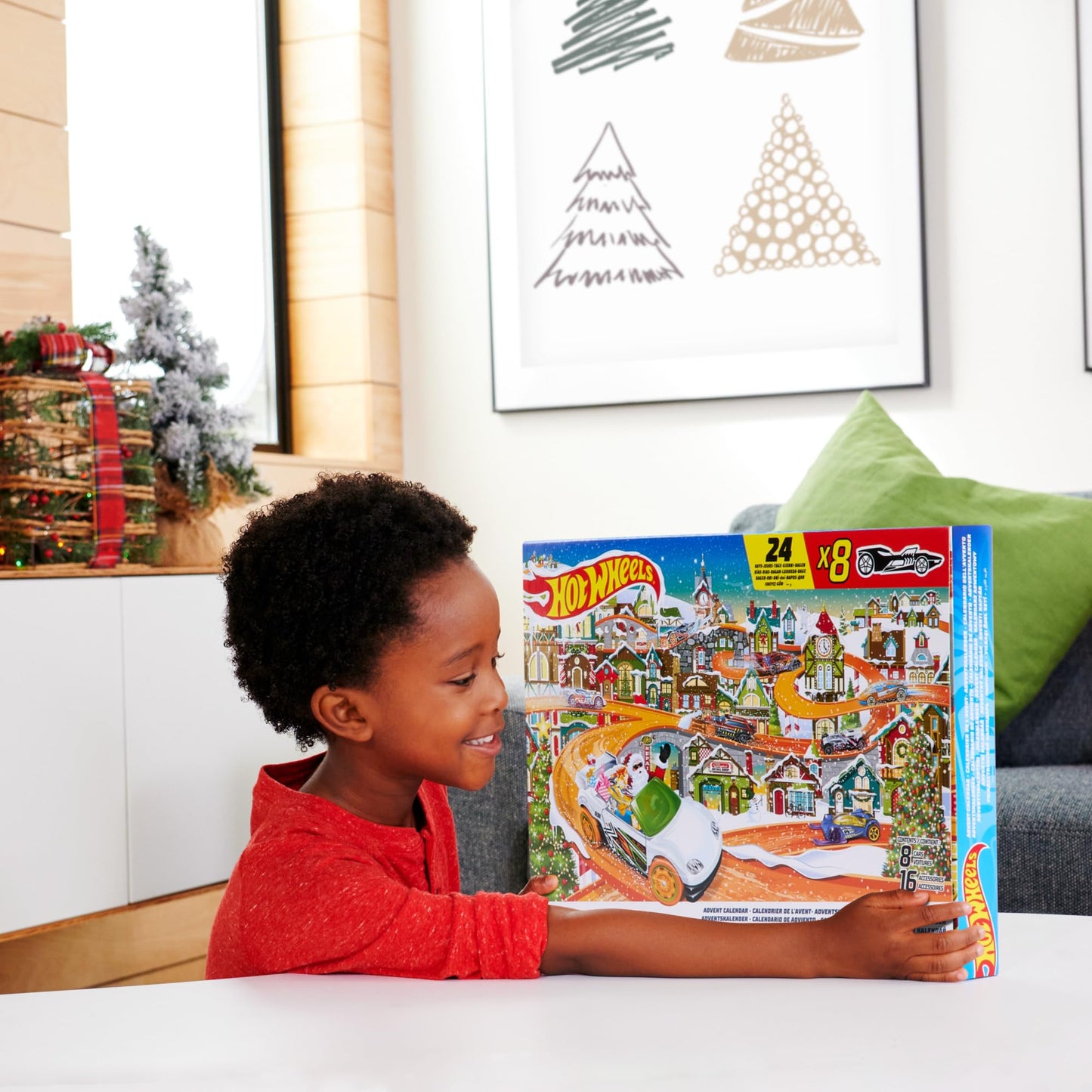 Hot Wheels Advent Calendar - 8 cars and 16 winter accessories behind 24 numbered doors, including a play mat, for kids and fans. HKL74