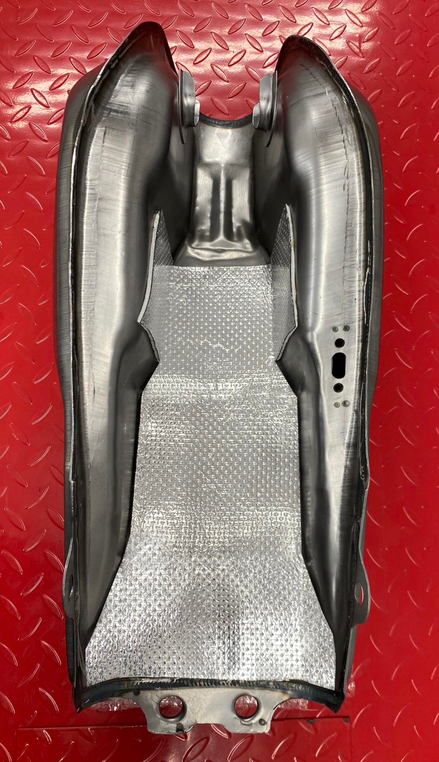 2 x self-adhesive heat shielding exhaust or engine aluminum reflective sheet 100cm x 33cm. Ideal for motorcycle fairings and cars.