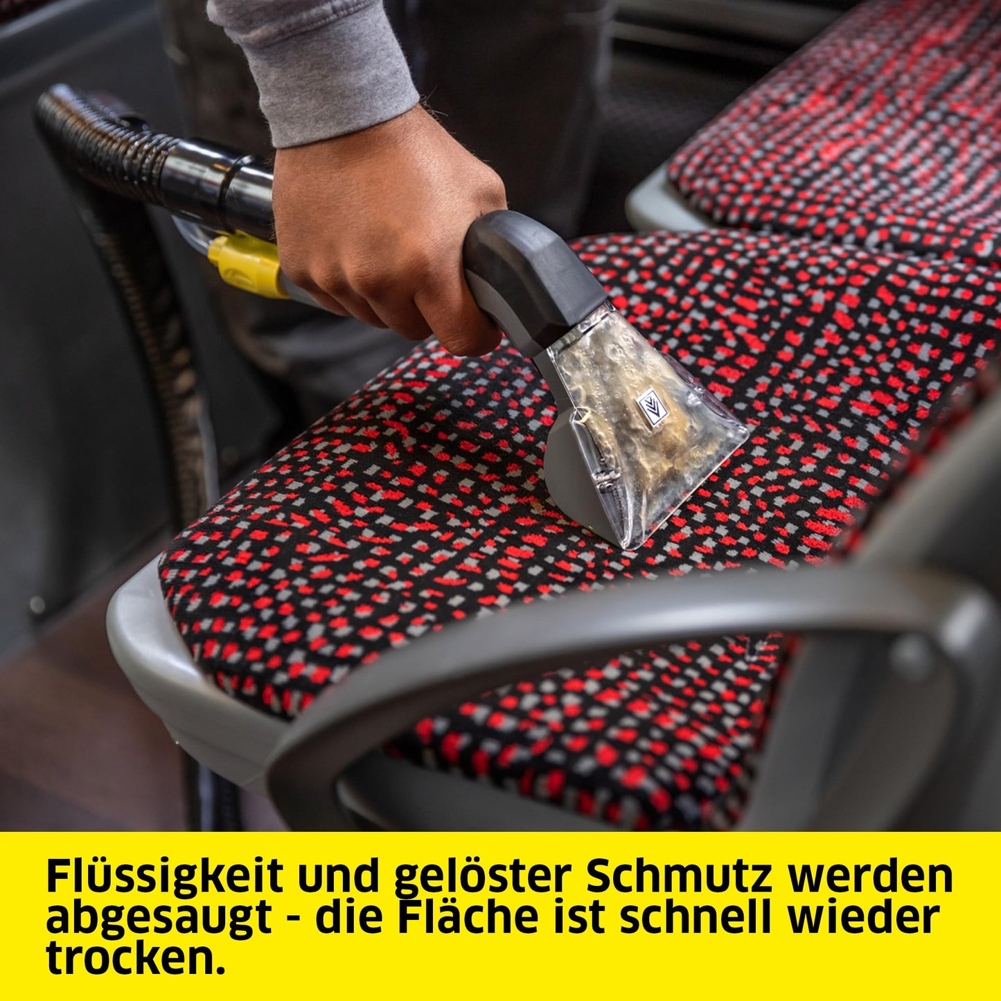 Kärcher carpet cleaner Puzzi 8/1, powerful for upholstery cleaning and spot removal on textiles, includes ergonomic short upholstery nozzle.