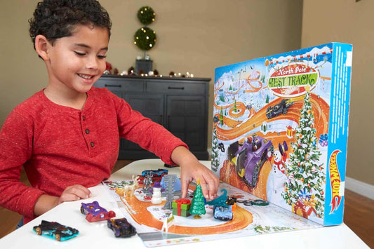 Hot Wheels Advent Calendar with 24 surprises, including 8 1:64 scale vehicles and other cool accessories, plus a play mat. Perfect Christmas gift for collectors and kids ages 3 and up. GTD78.