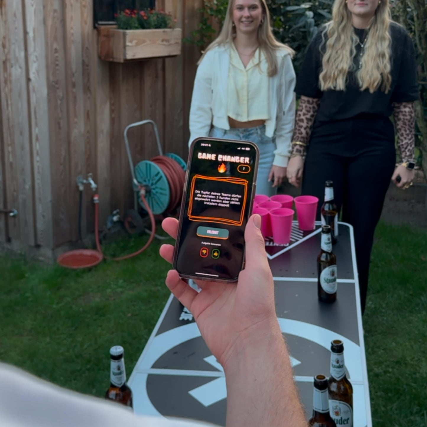 QR-Pong Interactive Beer Pong Set includes 20 hard plastic cups, 4 ping pong balls, in Black/Green/Pink.