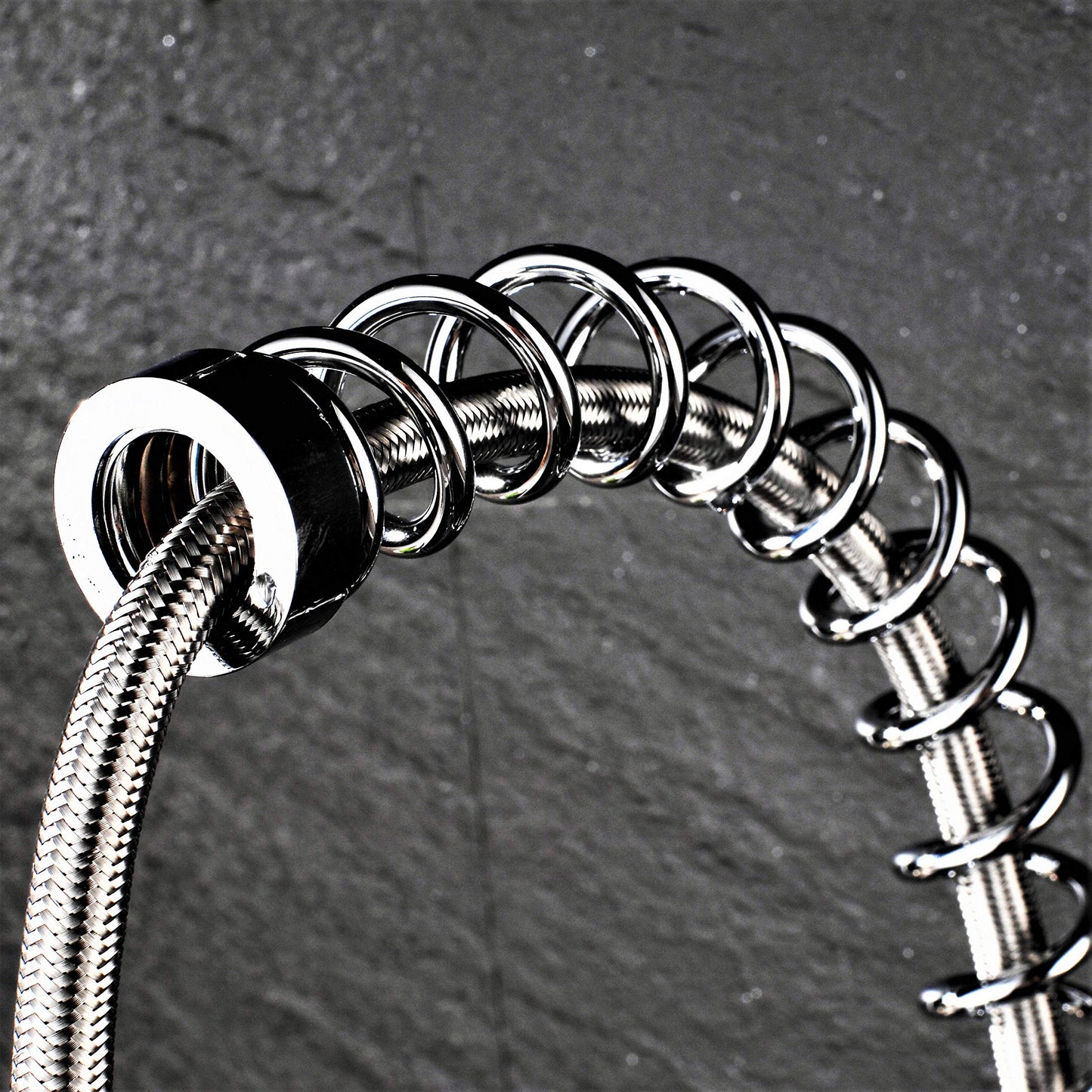 Professional kitchen sink mixer tap with shower spray, spiral spring, and extendable hose in gloss/chrome finish.