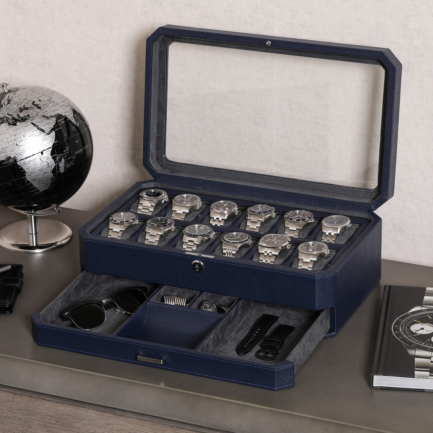 ROTHWELL 12-Slot Leather Watch Box with Valet Drawer is a luxury watch case display organizer. It features a microsuede liner and can hold men's accessories and jewelry in dark blue/grey.