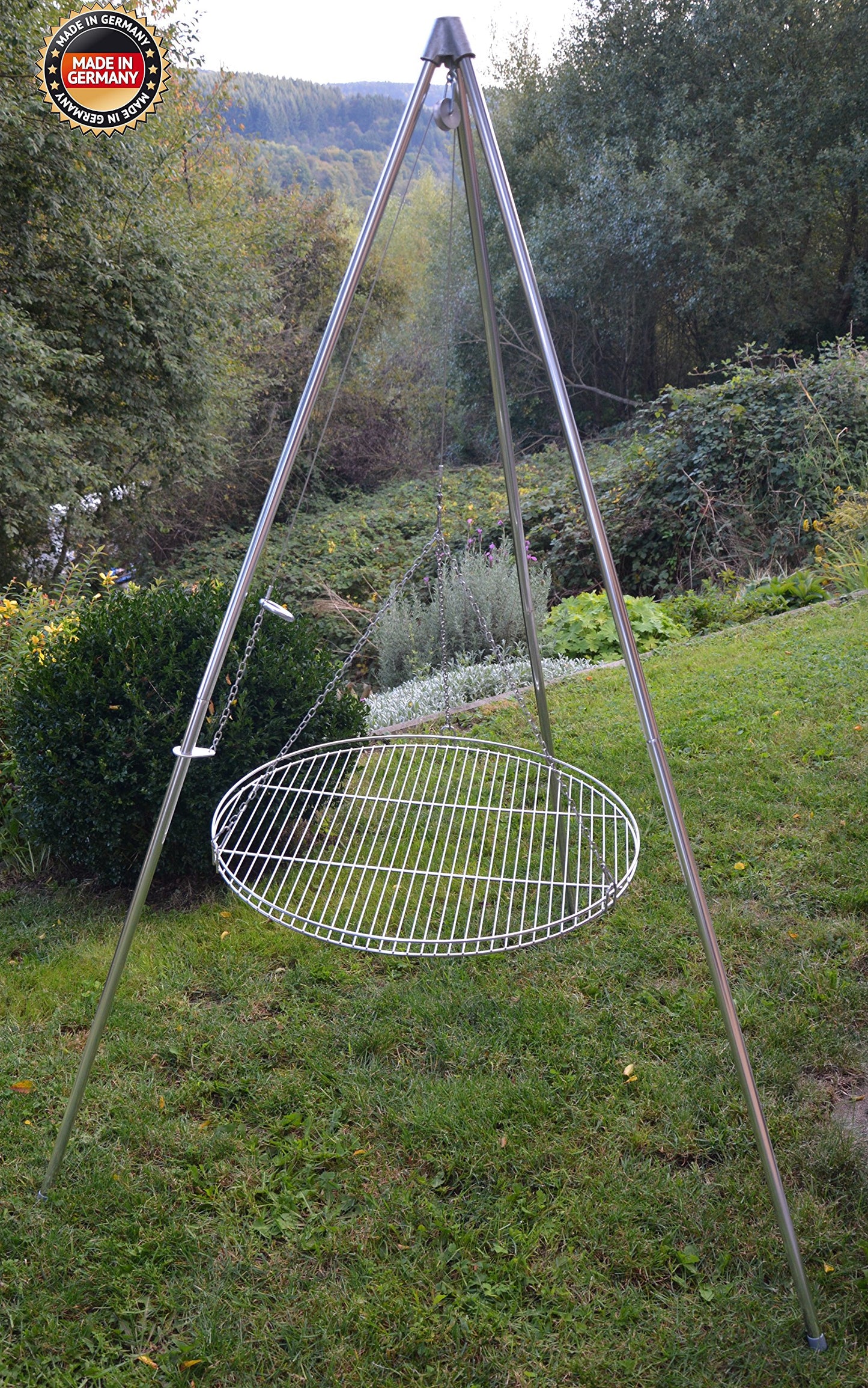 Three-legged swing grill including 60 cm stainless steel grate from German production.