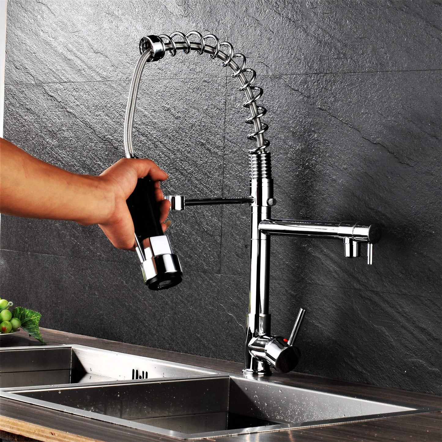 Professional kitchen sink mixer tap with shower spray, spiral spring, and extendable hose in gloss/chrome finish.