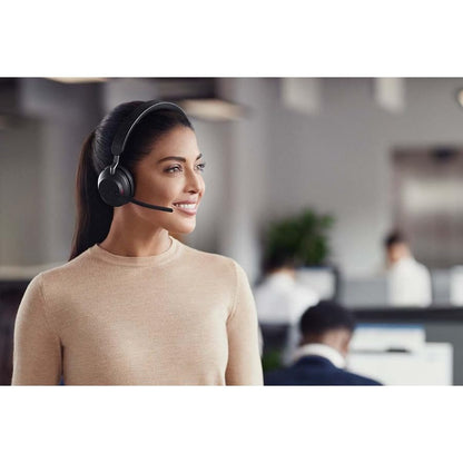 Jabra Evolve2 65 is a wireless PC headset with a charging stand. It has noise-canceling, Microsoft Teams certification, stereo sound, and a long-lasting battery. The set includes a USB-A Bluetooth adapter. Available in black.