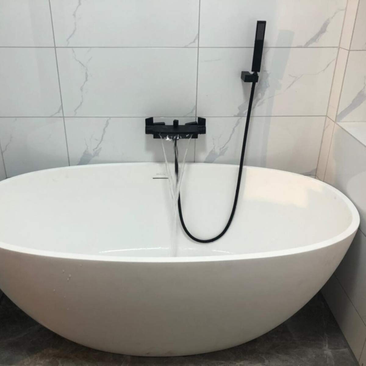 Black bathtub faucet with hand shower, shower systems, waterfall spout, wall mount, single lever mixer faucet for bathroom shower.