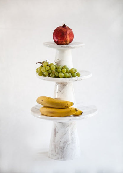 White marble design etagere as a serving platter or cake plate for the festive table.