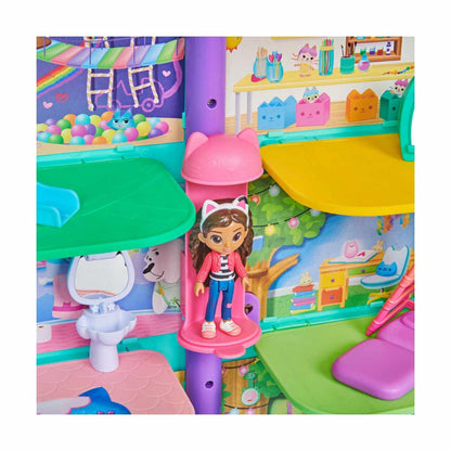Gabby's Dollhouse, a Purrfect dollhouse over 60cm tall with Gabby and Panda Paws figures, 8 furniture pieces, 3 accessories, 2 surprise boxes, and sounds. A gift for children 3 years and older.
