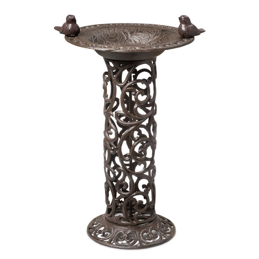 Large bird bath with decorative birds made of cast iron. Metal water bowl for feeding and garden decoration.