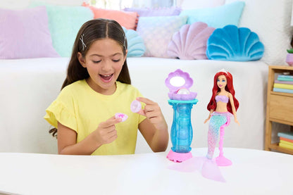 Mattel Disney Princess toys, Makeup Shell Mermaid Ariel Fashion Doll with removable tail fin, Vanity with 5 repeatable pop-up surprises and 5 accessories, JBF86