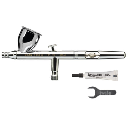 Iwata-Medea Eclipse HP CS Dual Action airbrush gun with gravity feed cup.