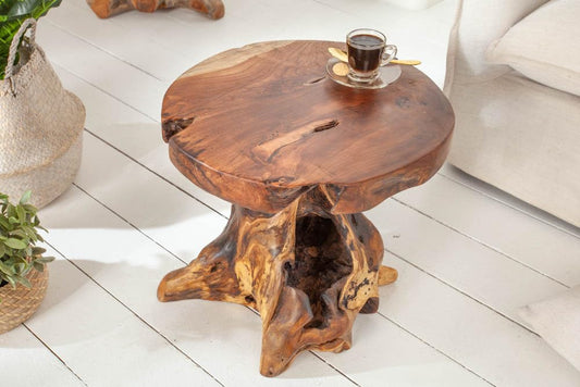 Invicta INTERIOR at riess-ambiente.de offers the tree trunk stool ROOT. Made of solid teak root wood, this versatile piece serves as a stool, side table or footrest in natural style.