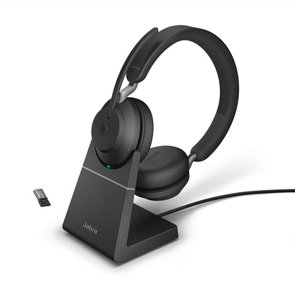 Jabra Evolve2 65 is a wireless PC headset with a charging stand. It has noise-canceling, Microsoft Teams certification, stereo sound, and a long-lasting battery. The set includes a USB-A Bluetooth adapter. Available in black.