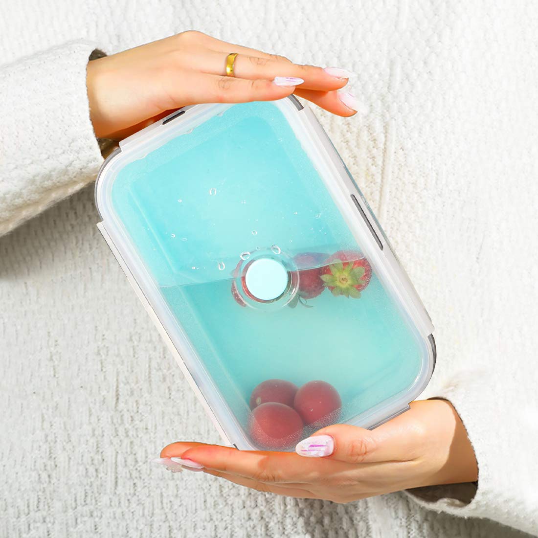 Collapsible silicone storage container with lid, portable bento box for space-saving, microwave-safe, set of 4, blue and grey.