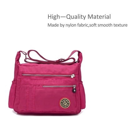 NICOLE & DORIS women's crossbody messenger bag in casual pink nylon, featuring multiple pockets and a zipper closure.