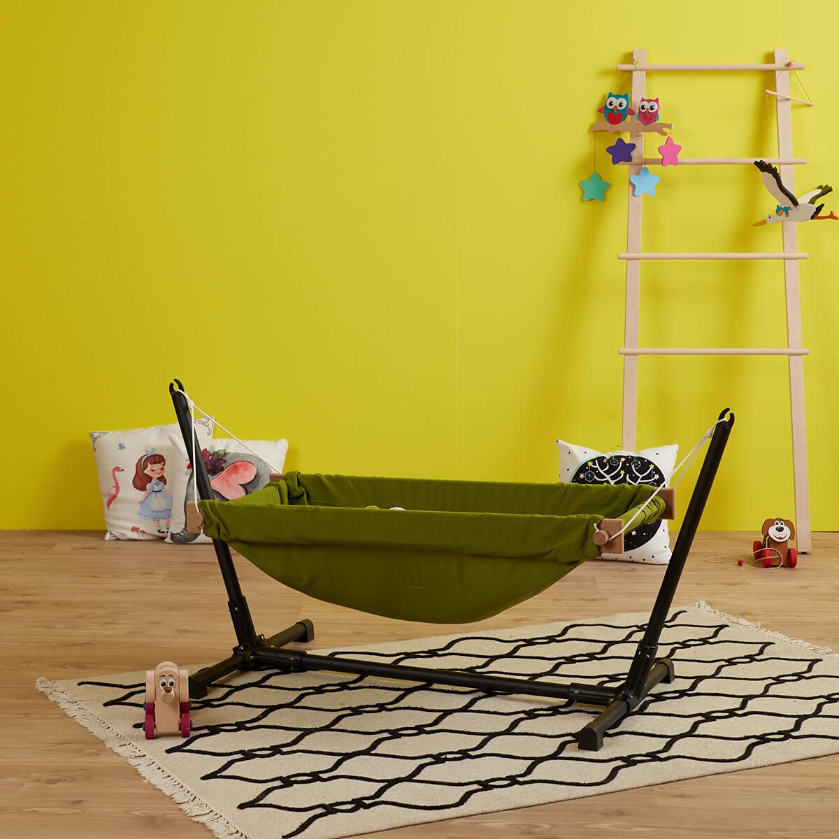 Baby Hammock with Stand. Made from 100% cotton, this travel-friendly baby hammock comes with a wooden swing stand for your little one to rest and play comfortably.