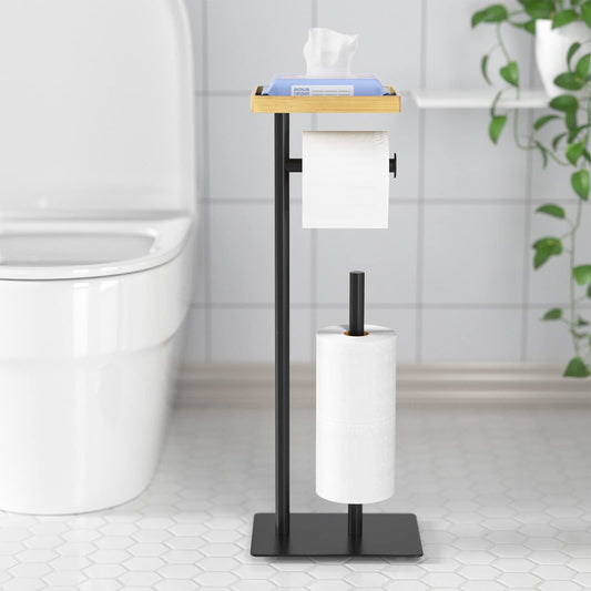 Free-standing toilet paper holder with top shelf in bamboo, black toilet paper roll holder stand, floor-standing toilet paper dispenser with space for 4 spare rolls.