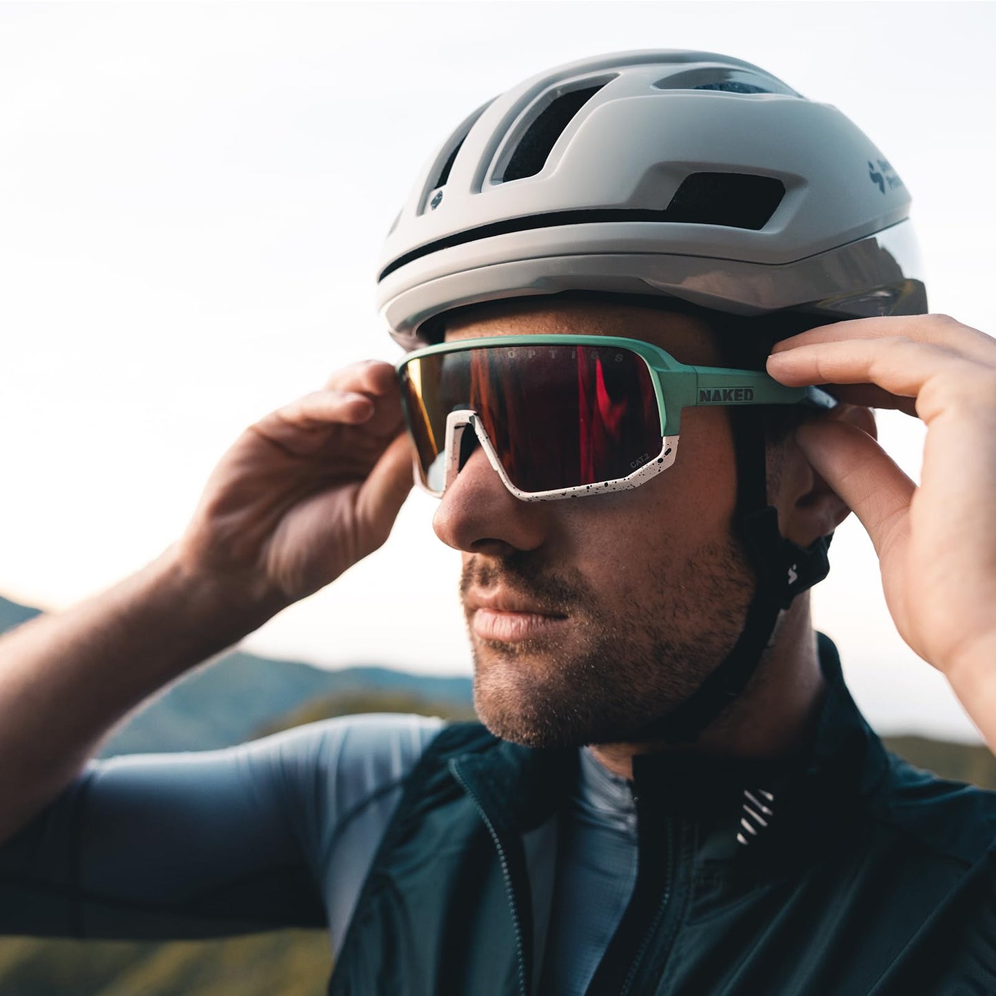 NAKED Optics VOLT sports sunglasses for men and women. UV400 protection, quick lenses, for cycling, running, and racing. Interchangeable lenses included. Color: White (Red lens).