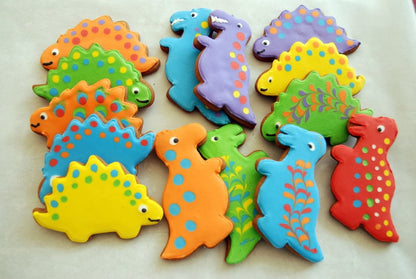 47-piece children's kitchen knife set with dinosaur cookie cutters and kid-friendly knives for cutting cakes, cookies, fruit, sandwiches, and vegetables.