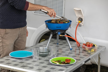 Campingaz Party Grill 400 Caravan, small camping grill for use with caravan gas connection, gas grill with versatile cooking options, gas cooker with non-stick coated grill plate and pot holder.