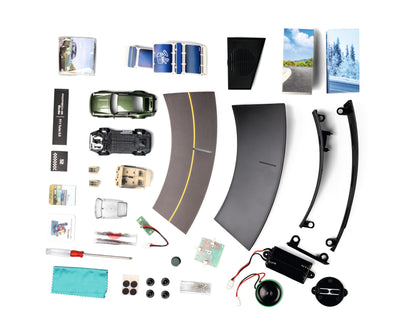 FRANZIS 55109 - Porsche 911 Turbo Advent calendar light green, metal model kit in 1:43 scale, including sound module and 52-page companion book.