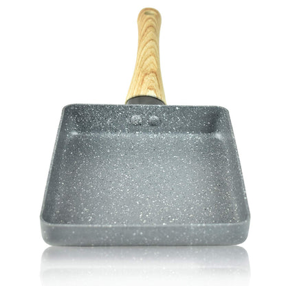 Artcome Japanese omelette pan with non-stick coating. Includes tamagoyaki plate, silicone spatula, and brush. Available in gray.