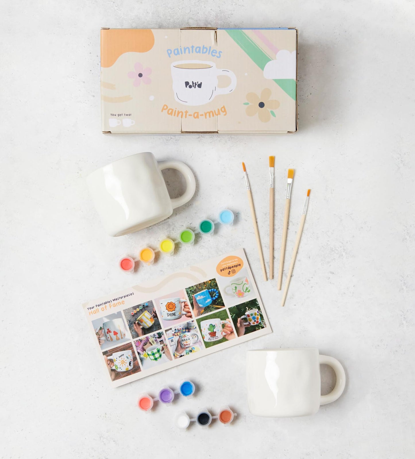 Pott'd Paintables cups for adults, ceramic painting set with cups, paints, brushes, and painting inspirations for painting the cups yourself.