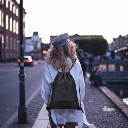 LIVACASA gym bag, made of water-resistant material with leather accents, lined with inner pocket and keychain. Perfect for men and women, this black gymsack includes an outer pocket and money pouch.