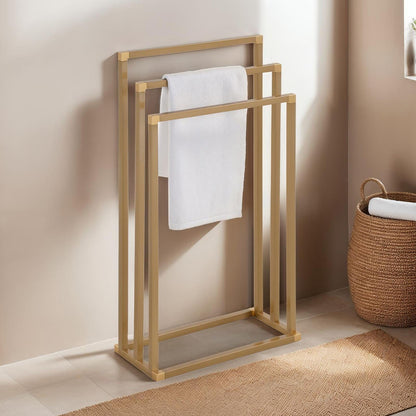 Towel holder KUNO, gold painted - freestanding towel rack with 3 bars, made of metal.