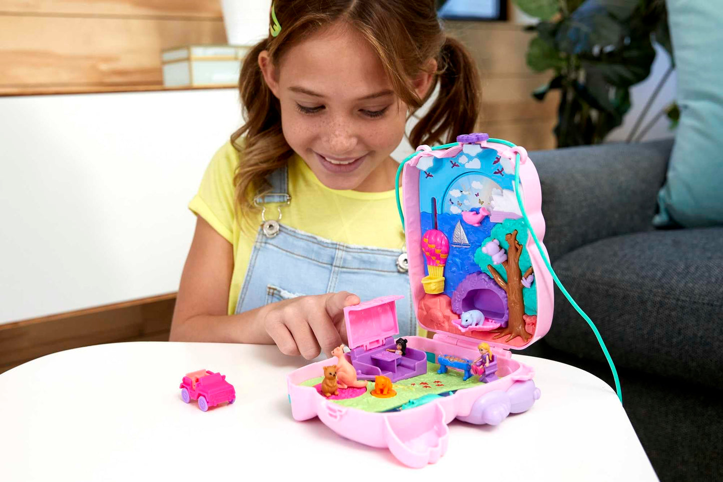 Polly Pocket carrying case, Koala Bear in animal adventure theme, includes 2 dolls, 5 animals, and 1 car, interactive features for immersive play, toy for ages 4 and up, GXC95.